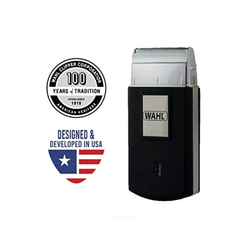 A Wahl electric clippers in black and silver, shown next to a '100 Years of Tradition' emblem and a 'Designed & Developed in USA' shield logo on a plain white background.