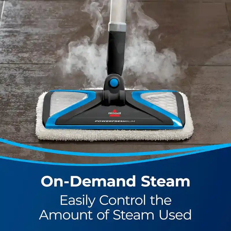 A steam mop head in use on a dark floor with visible steam rising, with a blue and white promotional banner at the bottom reading 'On-Demand Steam Easily Control the Amount of Steam Used.'.