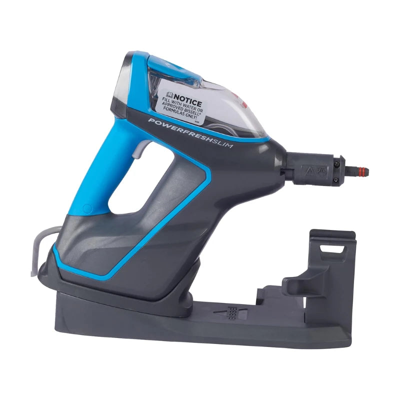 A Powerfresh Slim airless spray bottle in blue, gray, and black, shown resting on its matching dark gray charging dock against a solid white background.