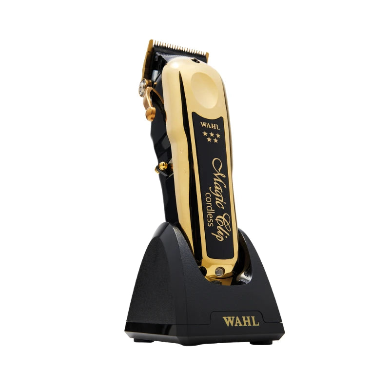 Gold and black Wahl Hair Clipper Pro Classic standing on its black charging base against a white background.