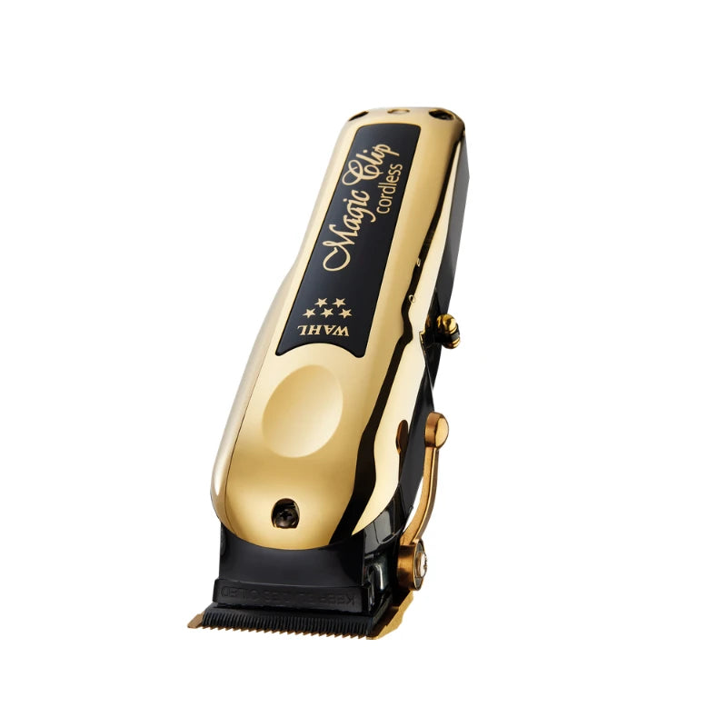A gold and black Magic Clip Concuss THYM electric hair clipper, shown from a three-quarters angle on a solid white background.