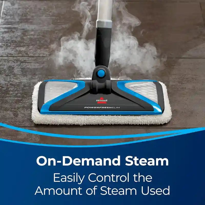 A steam mop head in use on a dark floor with visible steam rising, with a blue and white promotional banner at the bottom reading 'On-Demand Steam Easily Control the Amount of Steam Used.'.