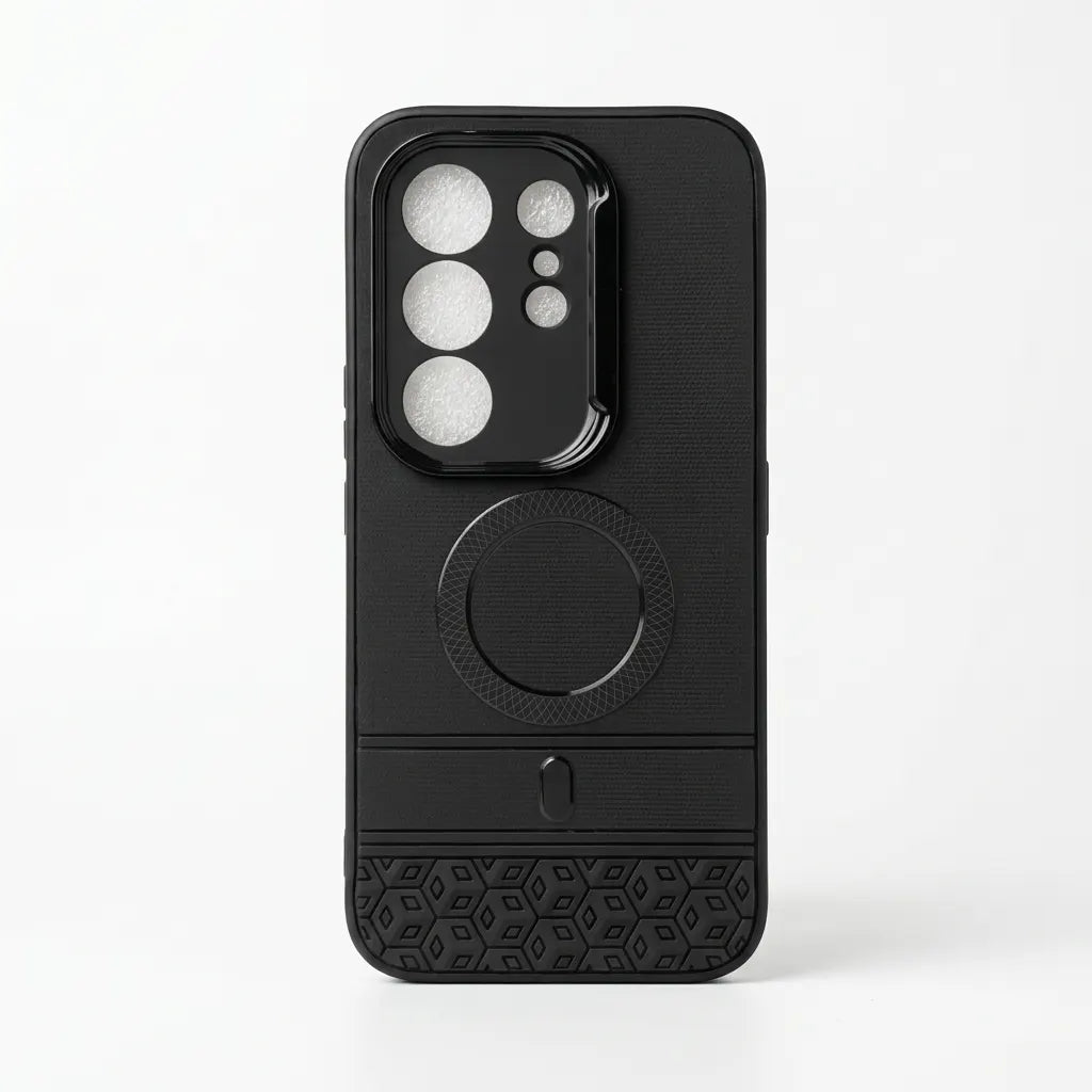 A black textured phone case with a built-in MagSafe ring, camera lens protector, and a geometric patterned grip at the bottom, shown on a white background.