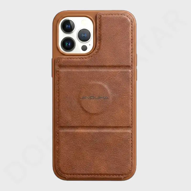 A brown leather phone case with a built-in card slot and MagSafe ring, shown on a light gray background.