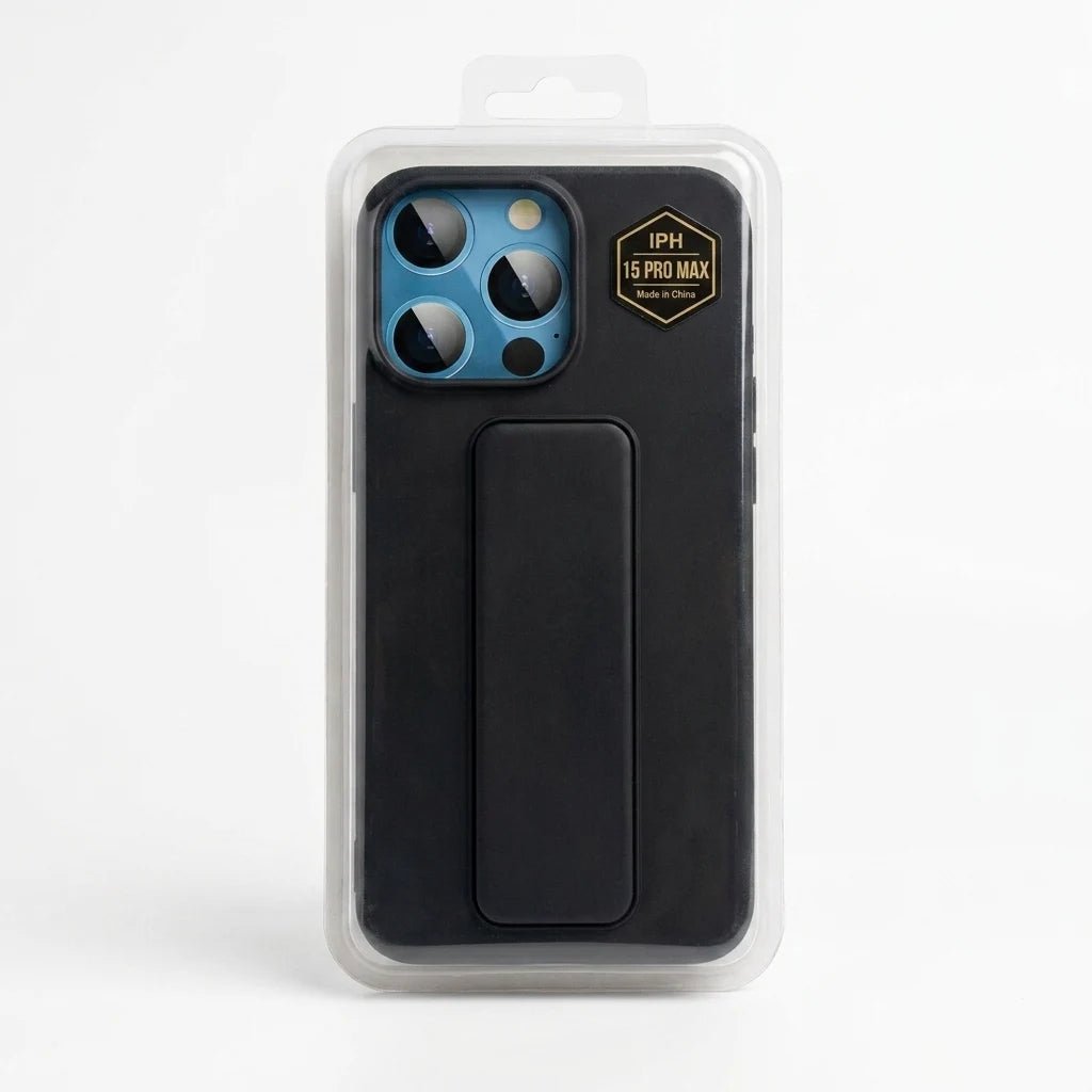 A black protective phone case with a built-in kickstand, shown inside its clear plastic retail packaging. The case is designed for an iPhone with a blue camera ring and features a gold 'IPHONE 15 PRO MAX' badge on the top right.