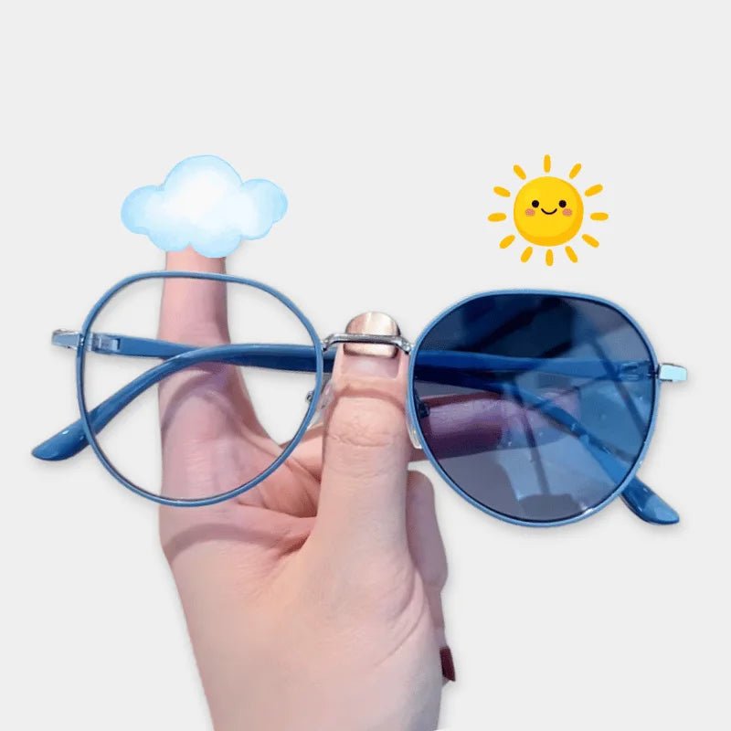 Hand holding blue sunglasses with cloud and sun icons on a white background