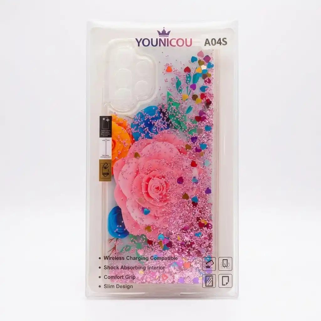 A phone case in its clear plastic retail packaging, featuring a large pink rose design filled with pink glitter, multicolored rhinestones, and colorful liquid glitter swirls.