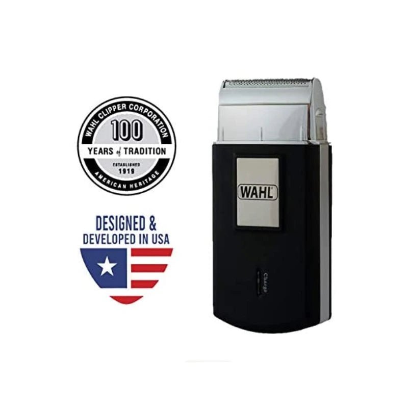A Wahl electric clippers in black and silver, shown next to a '100 Years of Tradition' emblem and a 'Designed & Developed in USA' shield logo on a plain white background.